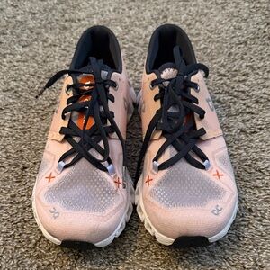 On Running Pink and Black Athletic Shoes